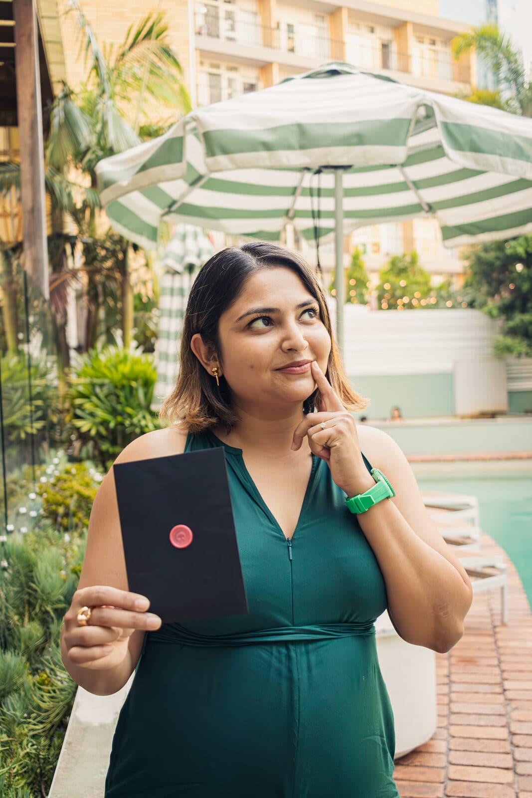 An agent thinking over a Classified clue by the pool