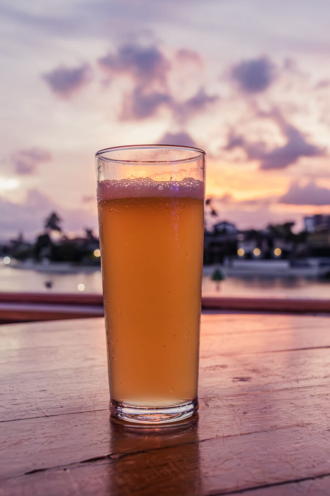 A drink at golden hour overlooking the water